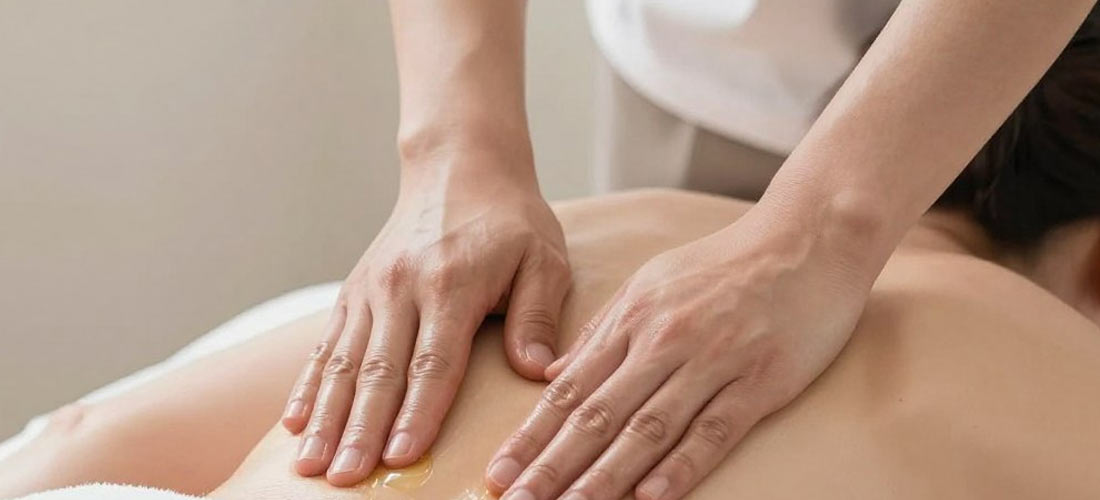 Professional B2B massage session showing therapeutic technique