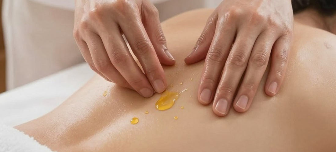 Close-up of massage oil application during b2b massage melaka session